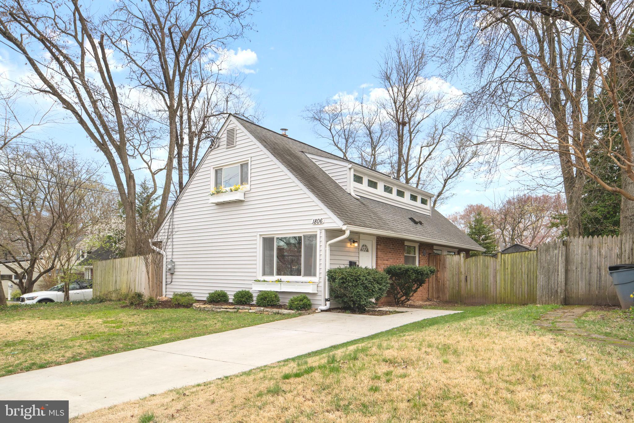 1806 Tilton Drive Silver Spring, MD 20902 - Photo 2 of 54 a front view of a house with a yard and garage