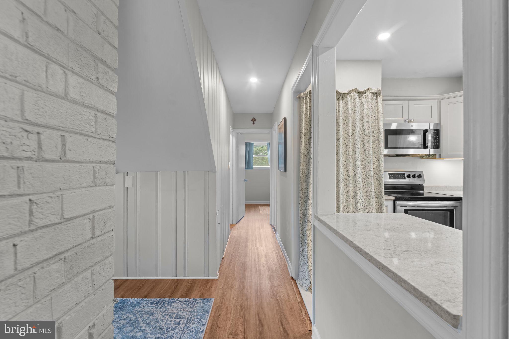 1806 Tilton Drive Silver Spring, MD 20902 - Photo 21 of 54 a view of a kitchen cabinets and wooden floor