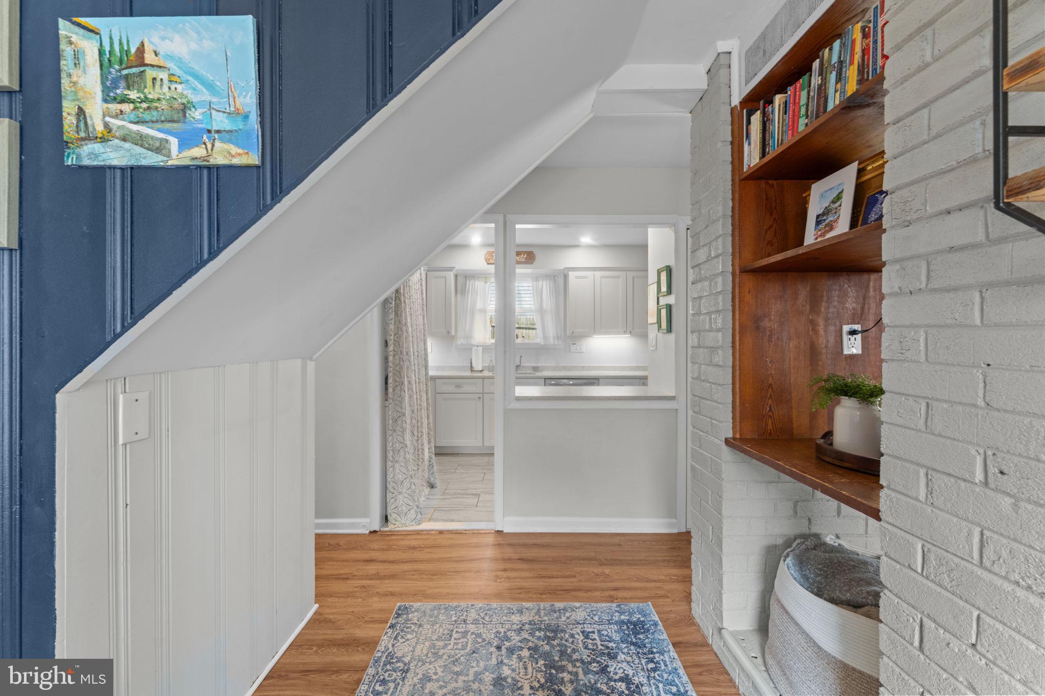 1806 Tilton Drive Silver Spring, MD 20902 - Photo 22 of 54 a view of a hallway with wooden floor and staircase