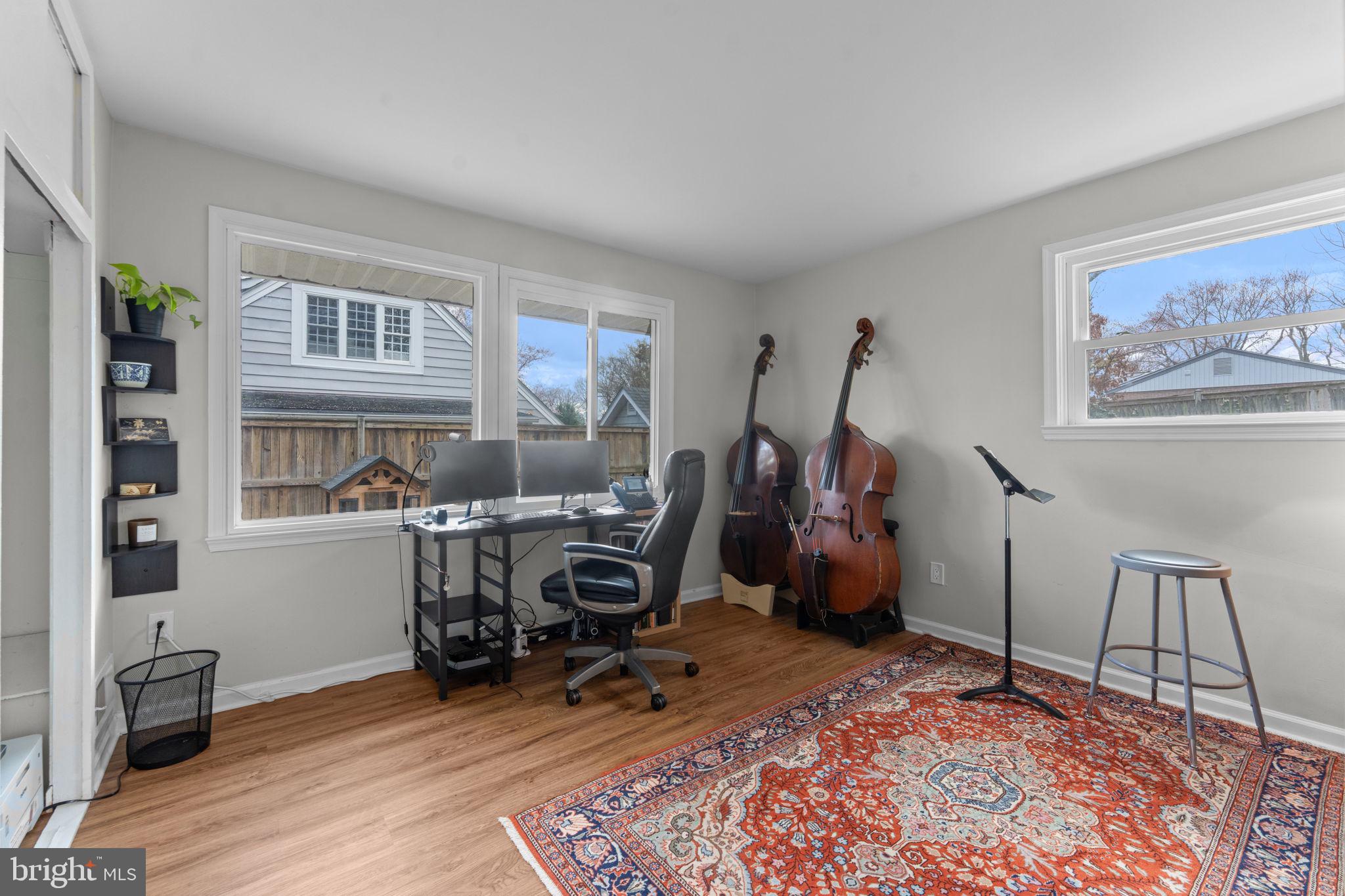 1806 Tilton Drive Silver Spring, MD 20902 - Photo 27 of 54 a view of a workspace with furniture and a bedroom