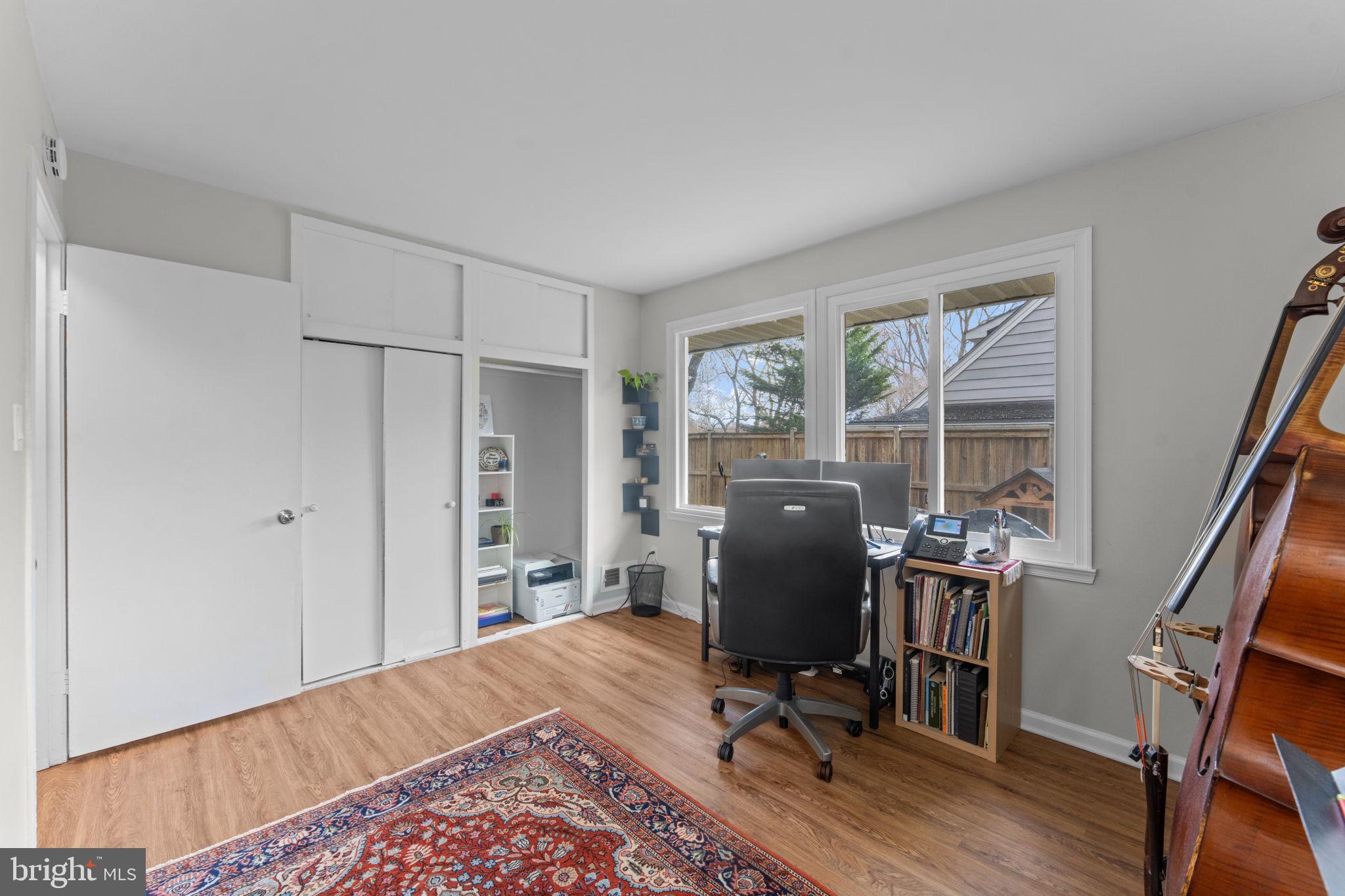1806 Tilton Drive Silver Spring, MD 20902 - Photo 28 of 54 a view of a workspace with furniture and a window