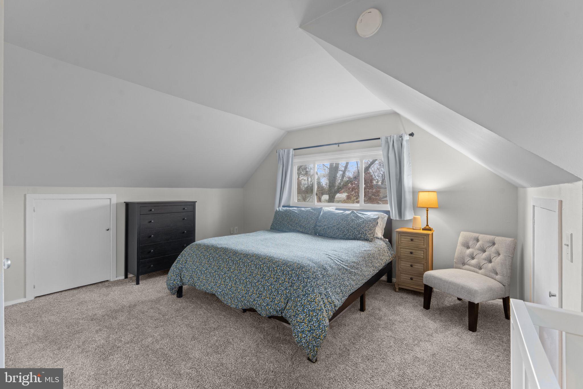 1806 Tilton Drive Silver Spring, MD 20902 - Photo 34 of 54 a bedroom with a bed and lamp