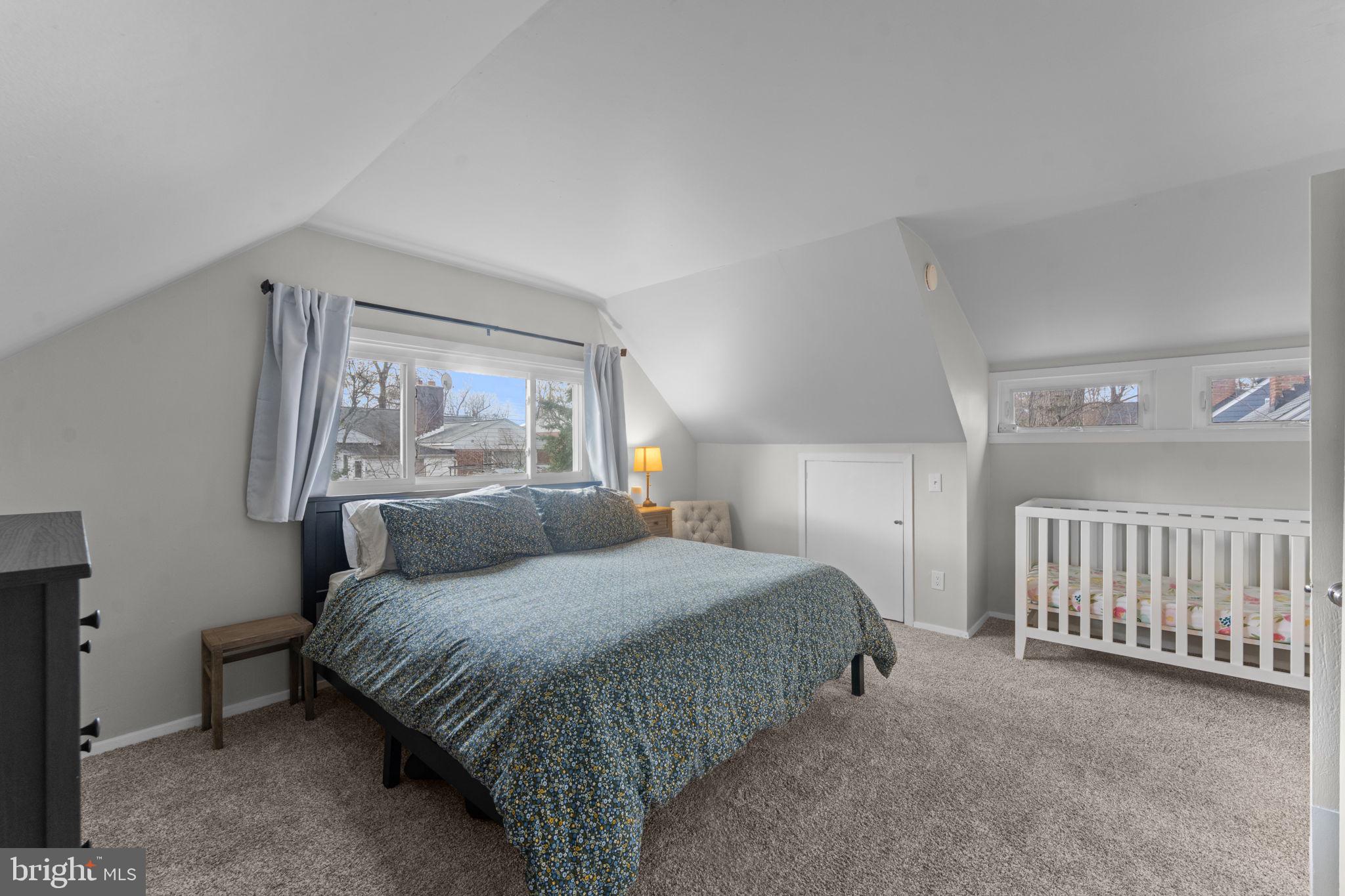 1806 Tilton Drive Silver Spring, MD 20902 - Photo 35 of 54 a bedroom with a bed and a large window