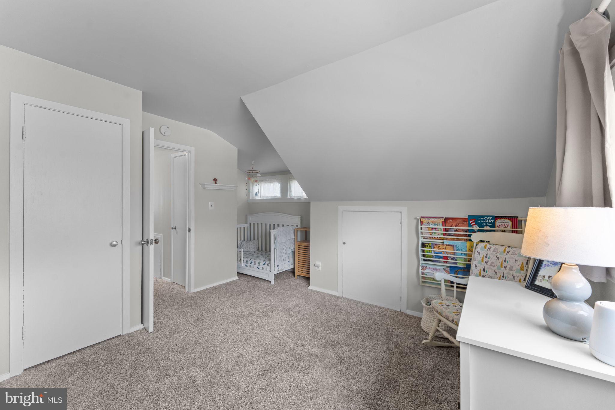 1806 Tilton Drive Silver Spring, MD 20902 - Photo 38 of 54 a living room with furniture and a lamp