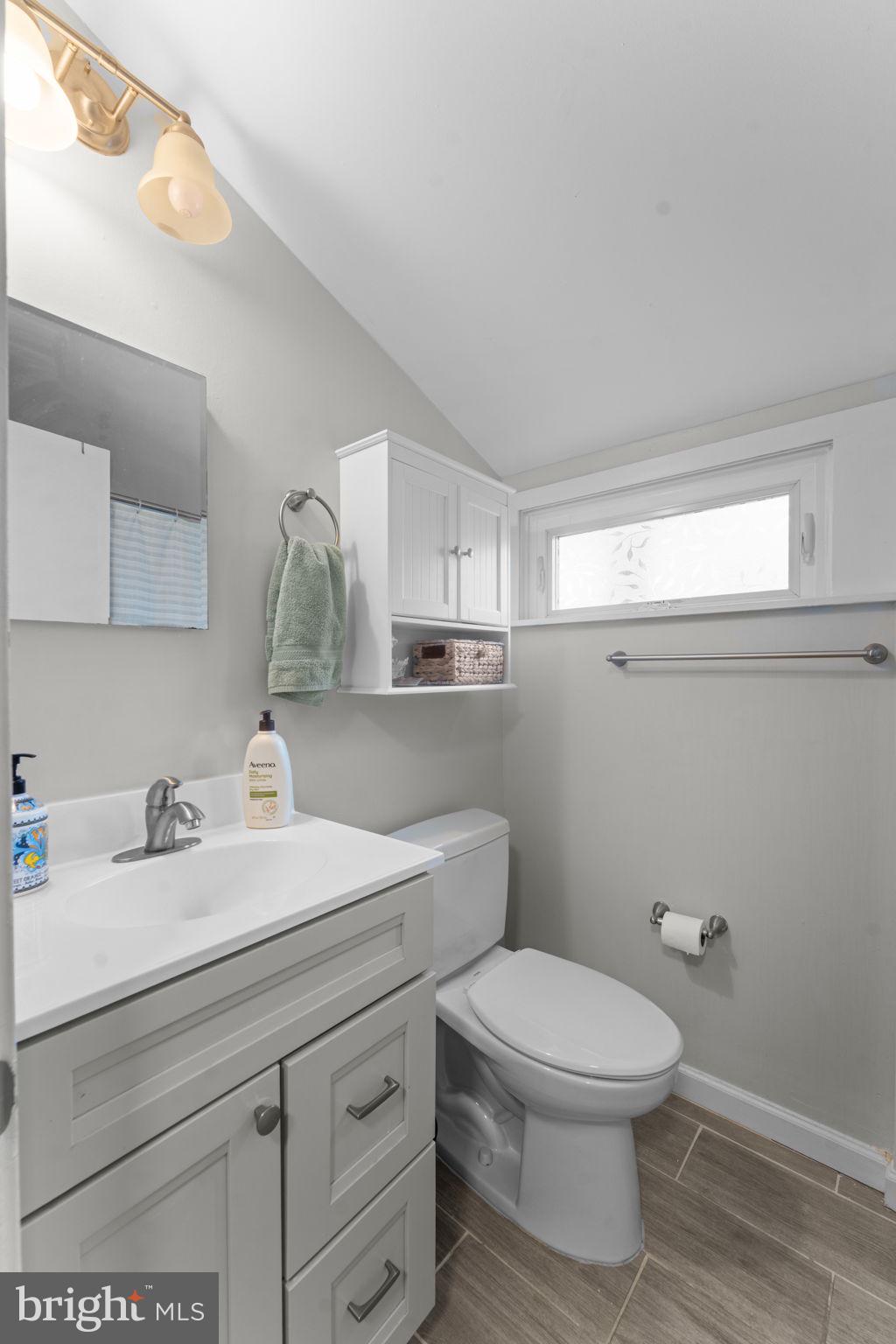 1806 Tilton Drive Silver Spring, MD 20902 - Photo 39 of 54 a bathroom with a toilet sink and mirror