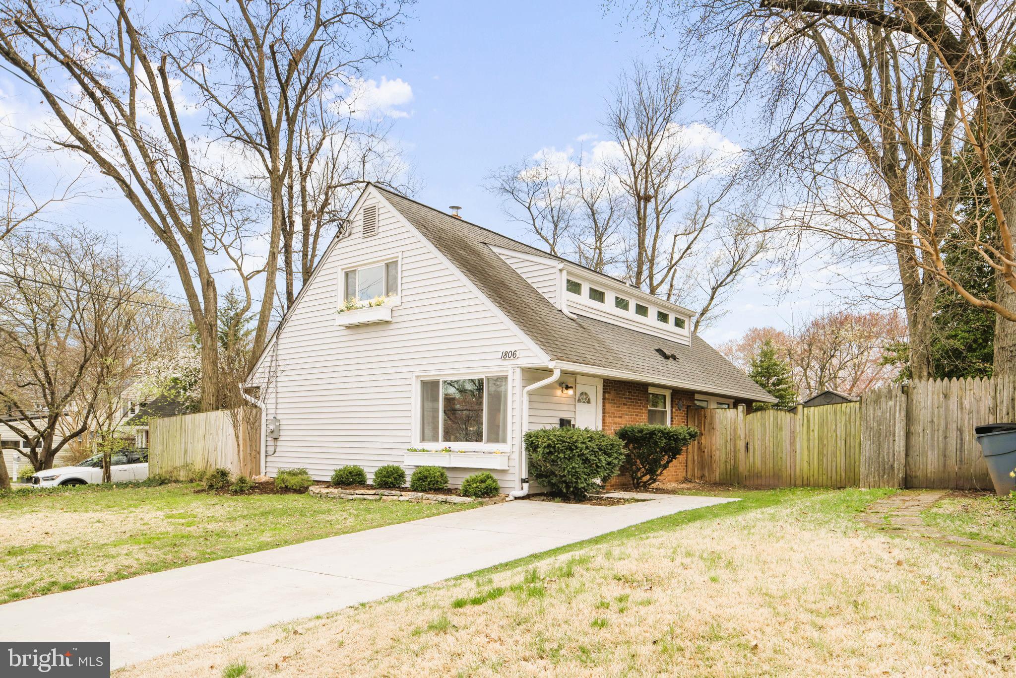 1806 Tilton Drive Silver Spring, MD 20902 - Photo 4 of 54 a front view of a house with a yard and garage