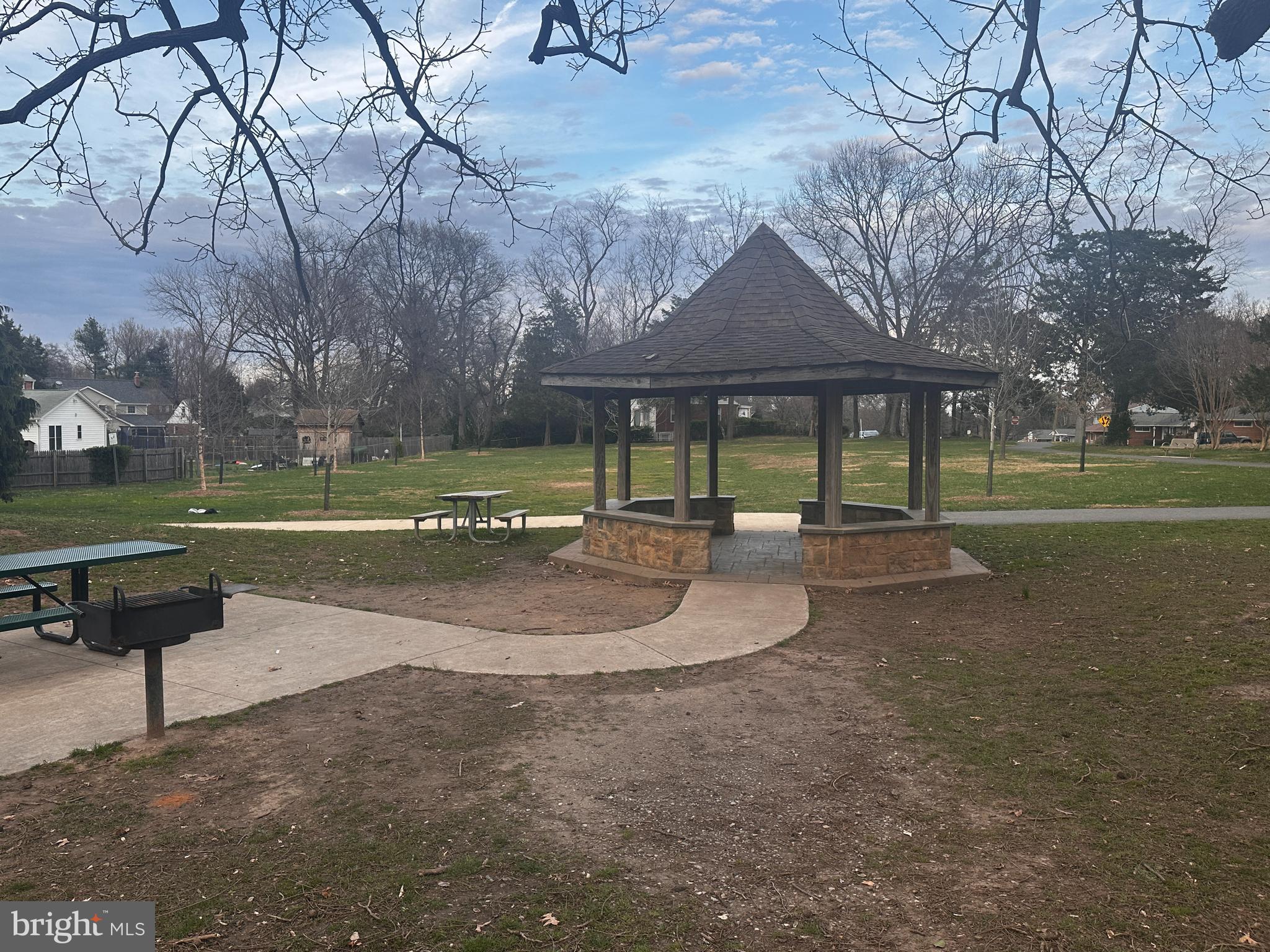 1806 Tilton Drive Silver Spring, MD 20902 - Photo 50 of 54 a view of a park with swings and a table