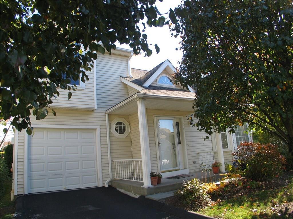 596 Glenbrook Road, Unit 22 Stamford, CT 06906 - Photo 1 of 1 a front view of a house with a tree