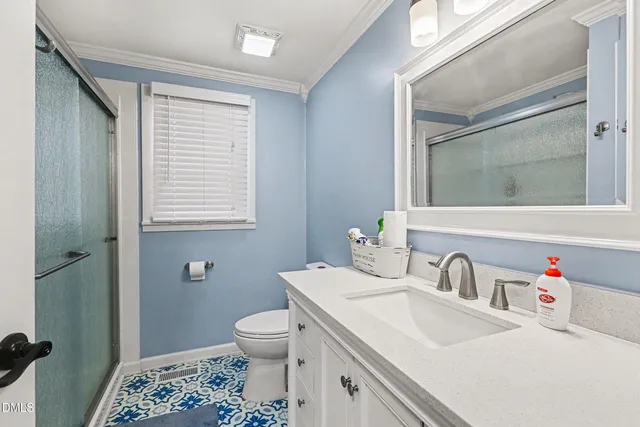 a bedroom with a bed a desk and chair