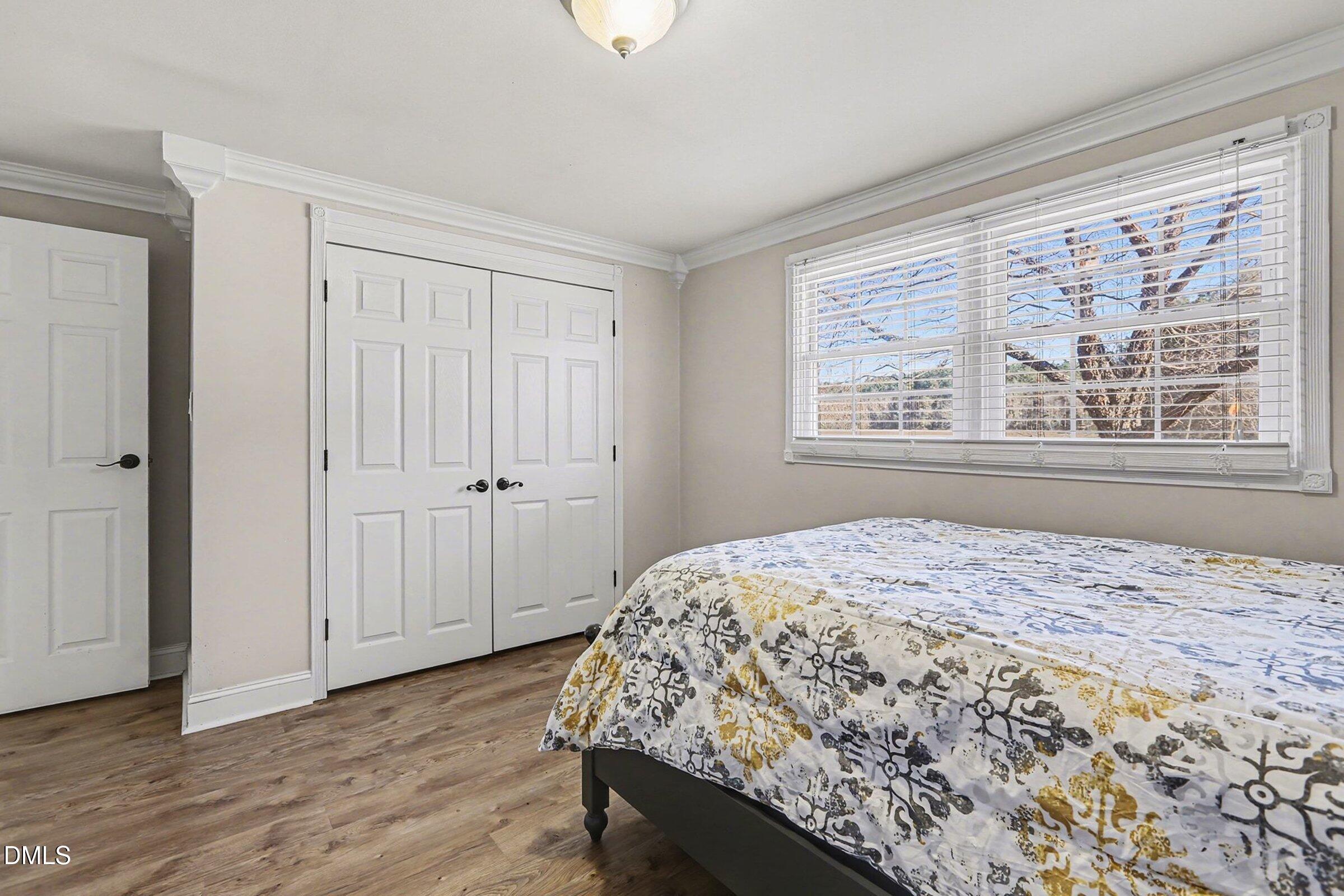774 Abbott Road Henderson, NC 27537 - Photo 20 of 31 a bedroom with a bed and a window