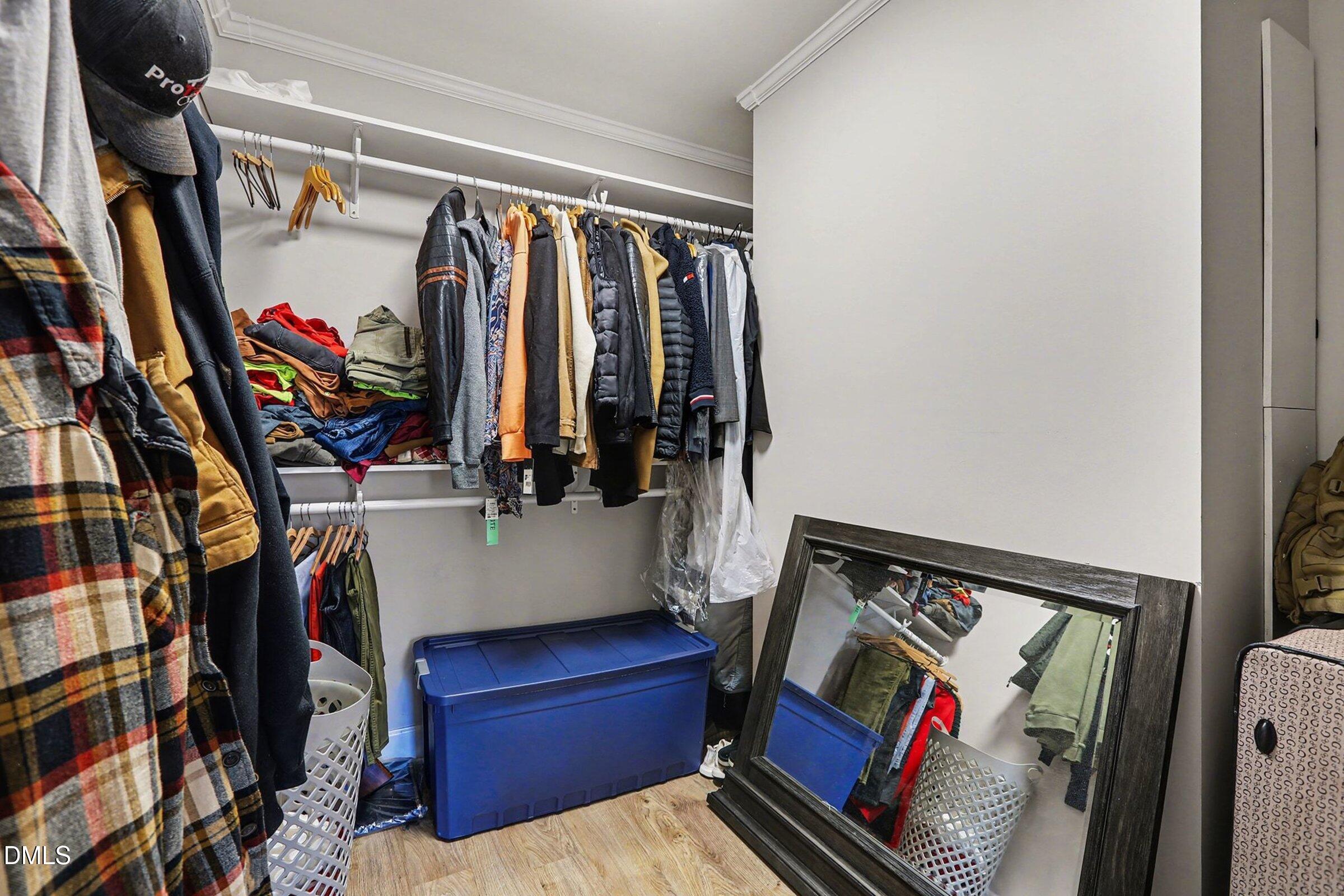 774 Abbott Road Henderson, NC 27537 - Photo 27 of 31 a view of walk in closet with clothes and shoes