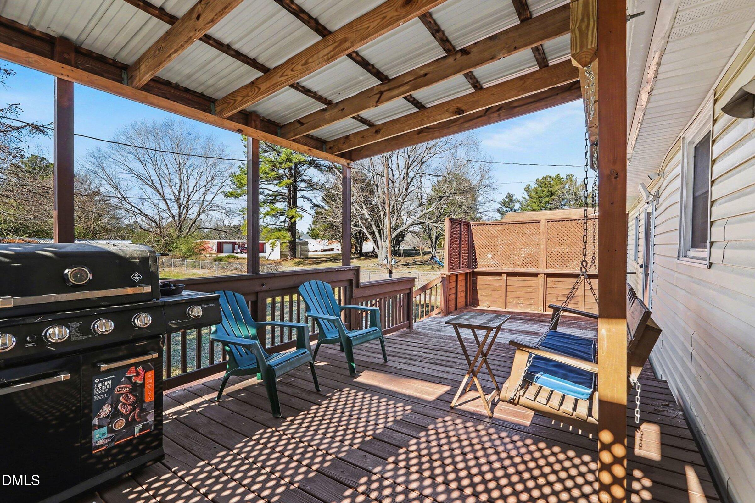 774 Abbott Road Henderson, NC 27537 - Photo 28 of 31 a view of a chairs and table in the balcony
