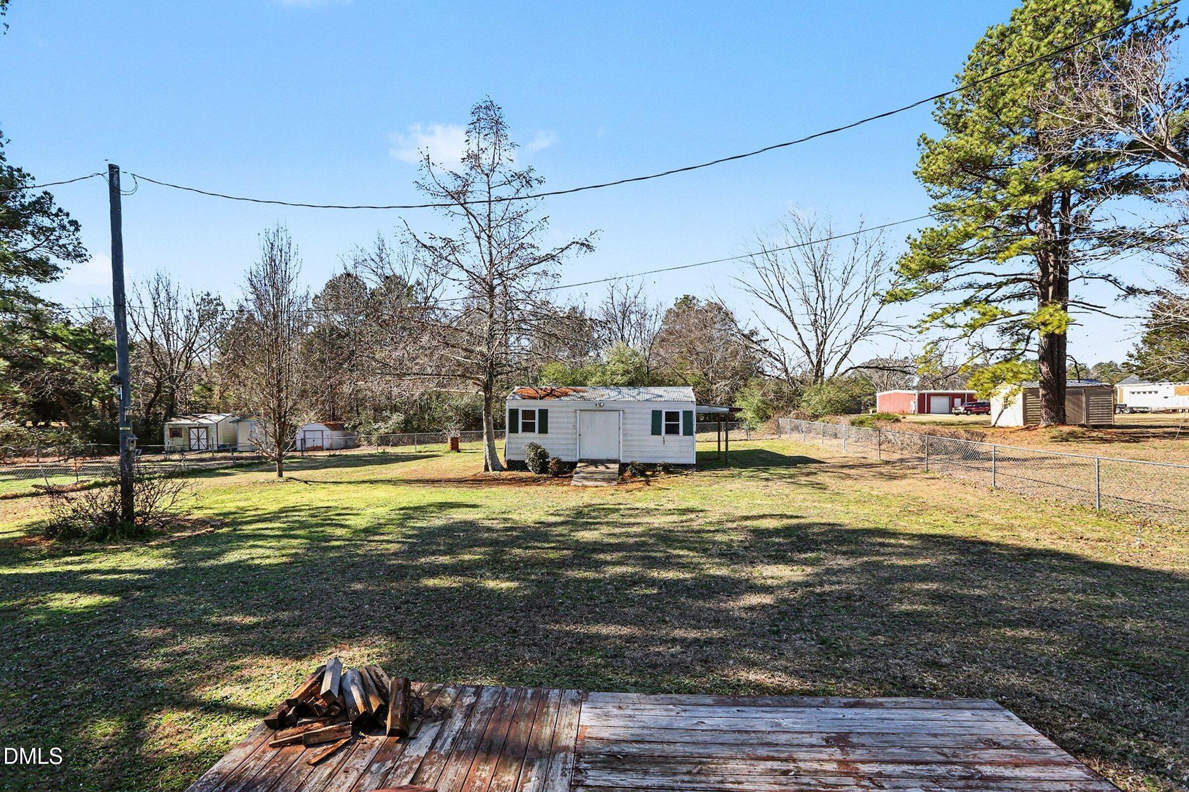 774 Abbott Road Henderson, NC 27537 - Photo 29 of 31 a swimming pool with trees in front of it