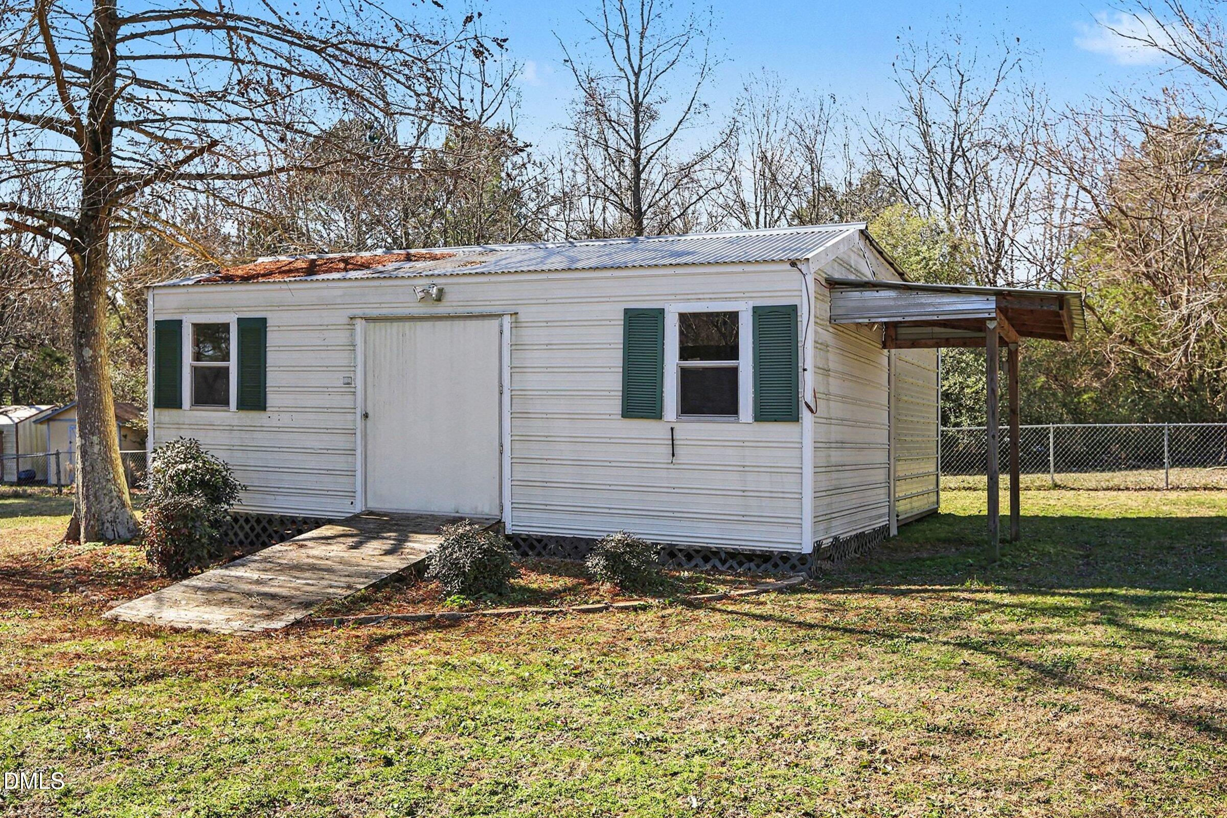 774 Abbott Road Henderson, NC 27537 - Photo 30 of 31 a view of a house with a yard