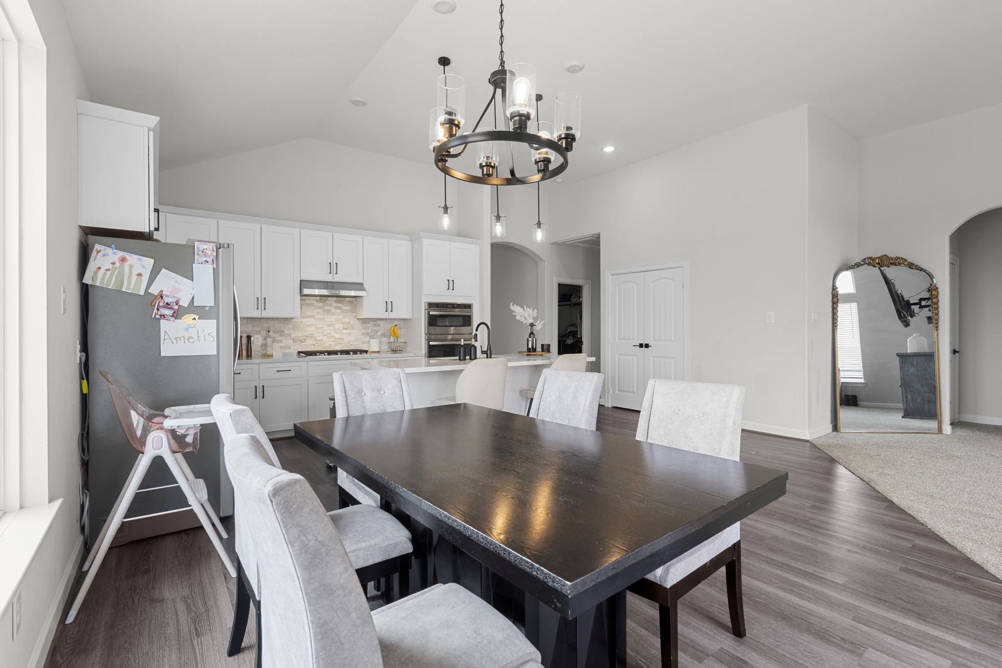 1294 County Road 5100 Cleveland, TX 77327 - Photo 13 of 27 Perfectly positioned off the kitchen, this spacious dining area offers a seamless flow for entertaining and family dinners.