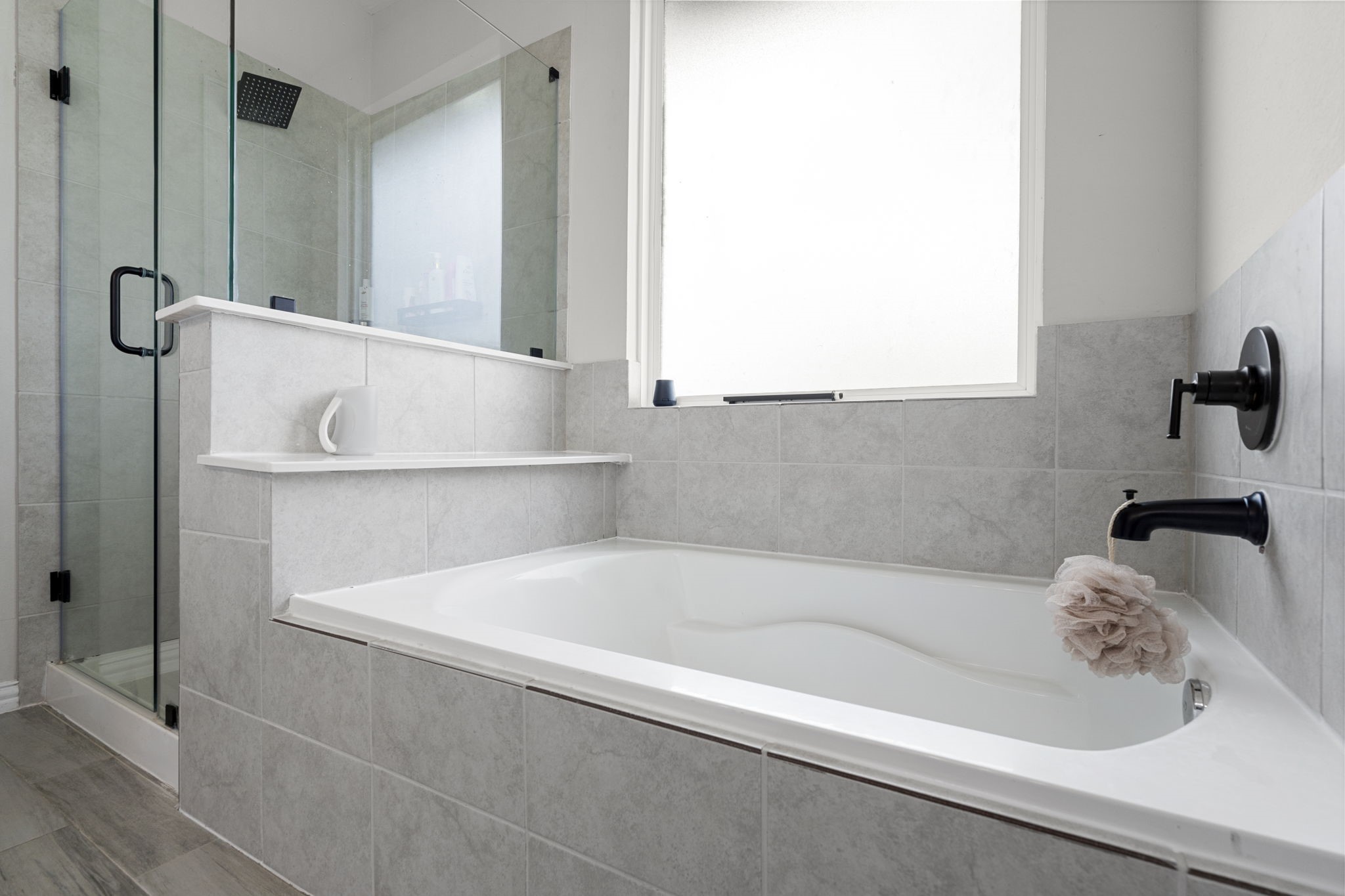 1294 County Road 5100 Cleveland, TX 77327 - Photo 20 of 27 Relaxing with a soaking tub, walk-in shower, and contemporary finishes.