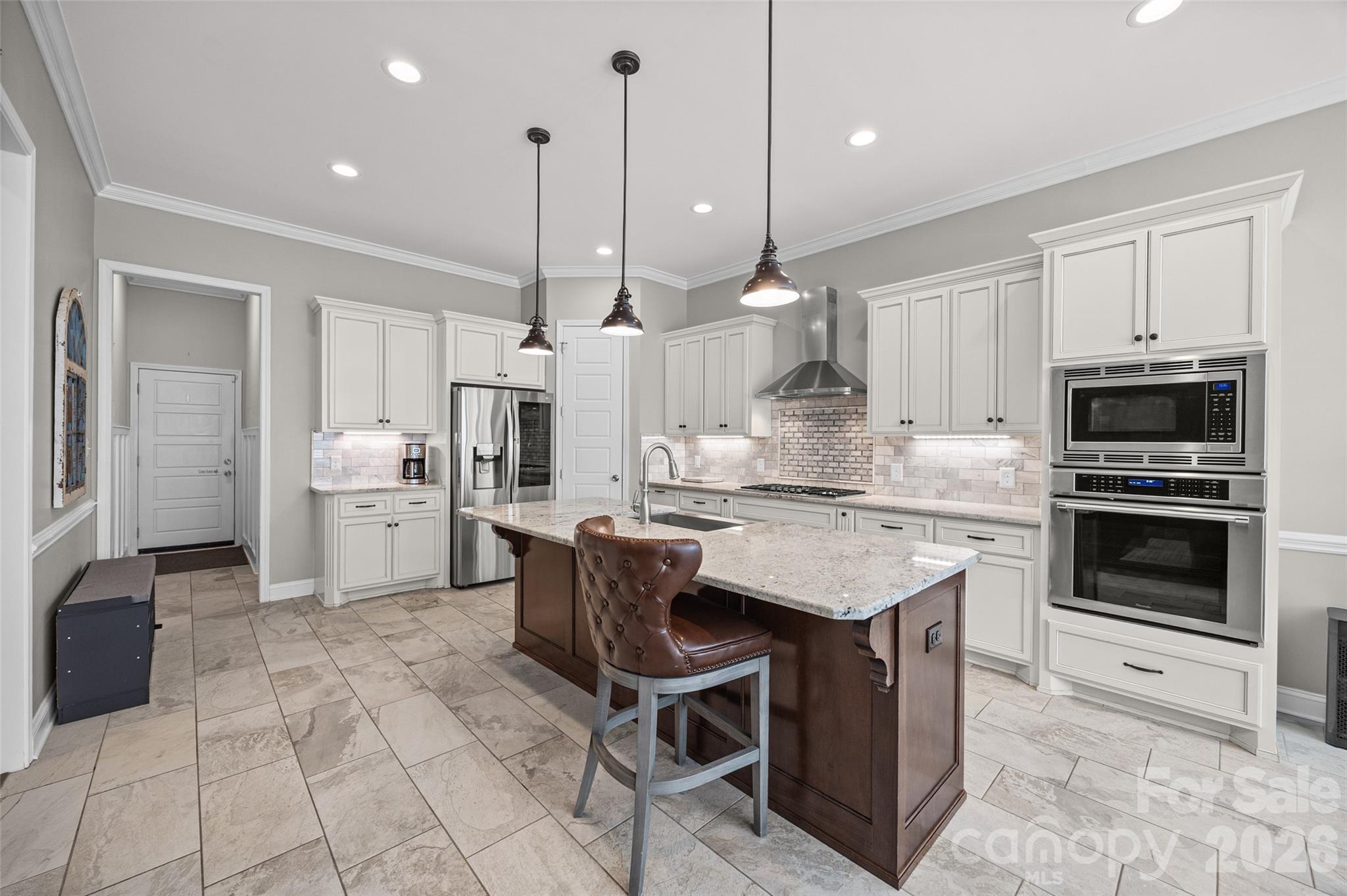 790 Brandon Road Clover, SC 29710 - Photo 18 of 43 a kitchen with kitchen island a counter space a appliances and cabinets