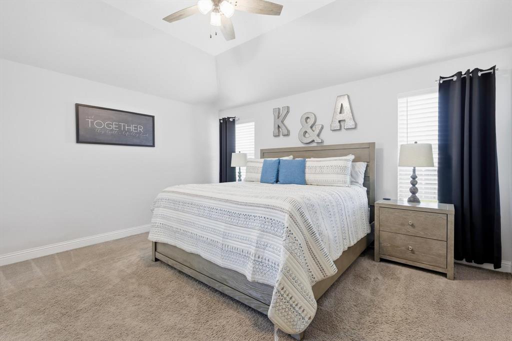 4101 Windmill Court Sanger, TX 76266 - Photo 18 of 36 a bedroom with a bed and a large window