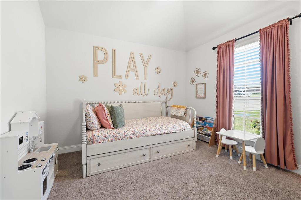4101 Windmill Court Sanger, TX 76266 - Photo 24 of 36 a bedroom with a bed and a window