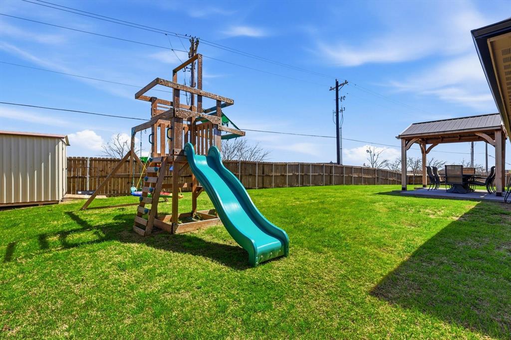 4101 Windmill Court Sanger, TX 76266 - Photo 32 of 36 a view of a park with a slide
