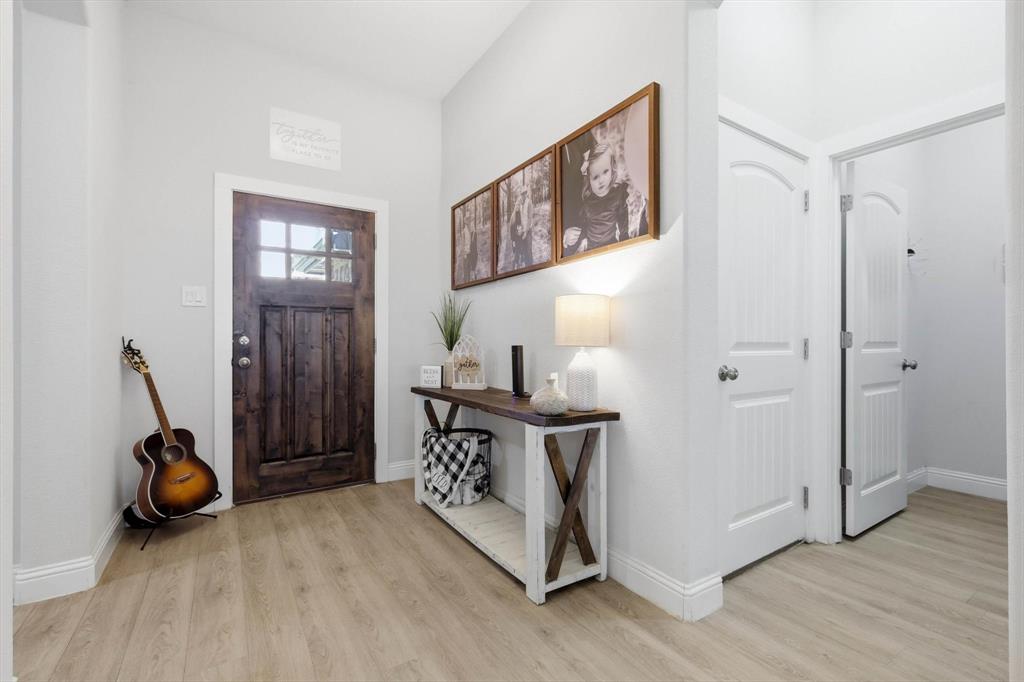 4101 Windmill Court Sanger, TX 76266 - Photo 6 of 36 a view of a room with wooden floor and windows