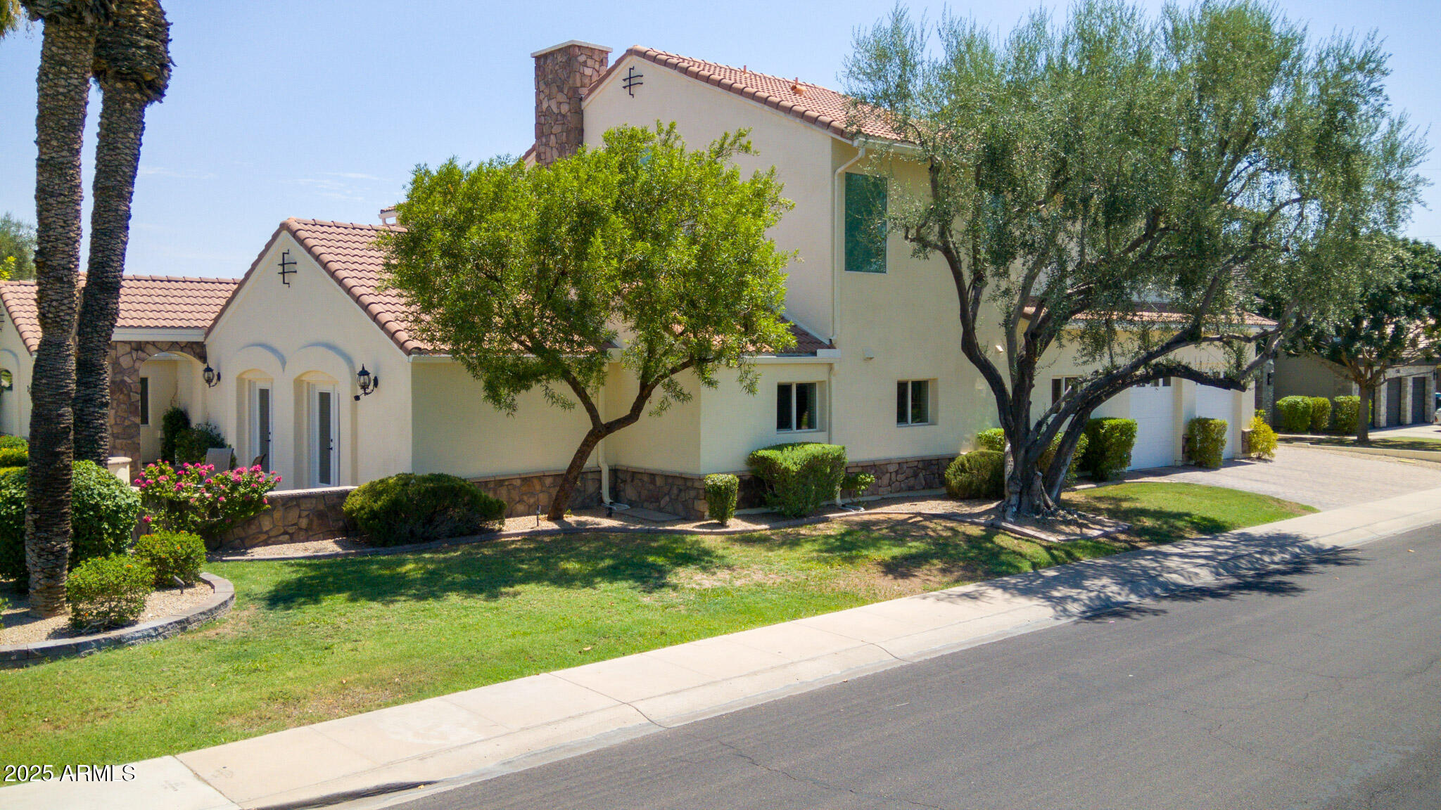 229 West Vista Avenue Phoenix, AZ 85021 - Photo 11 of 115 a front view of a house with a yard and garage