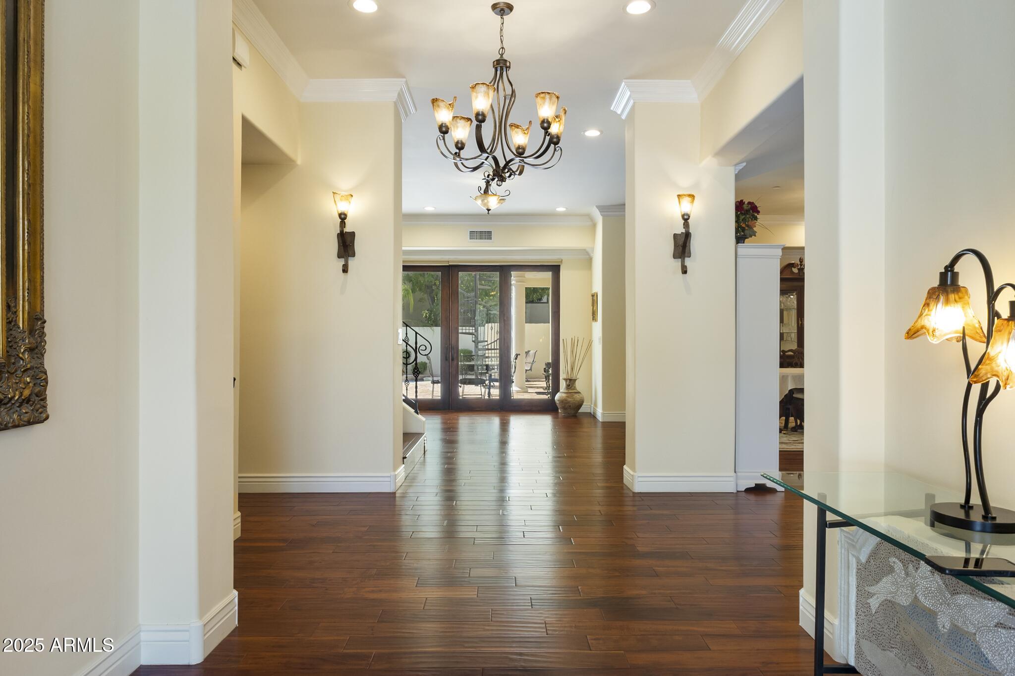 229 West Vista Avenue Phoenix, AZ 85021 - Photo 15 of 115 a view of a hallway with wooden floor and a chandelier