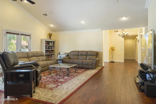 a room with gym equipment and a flat screen tv