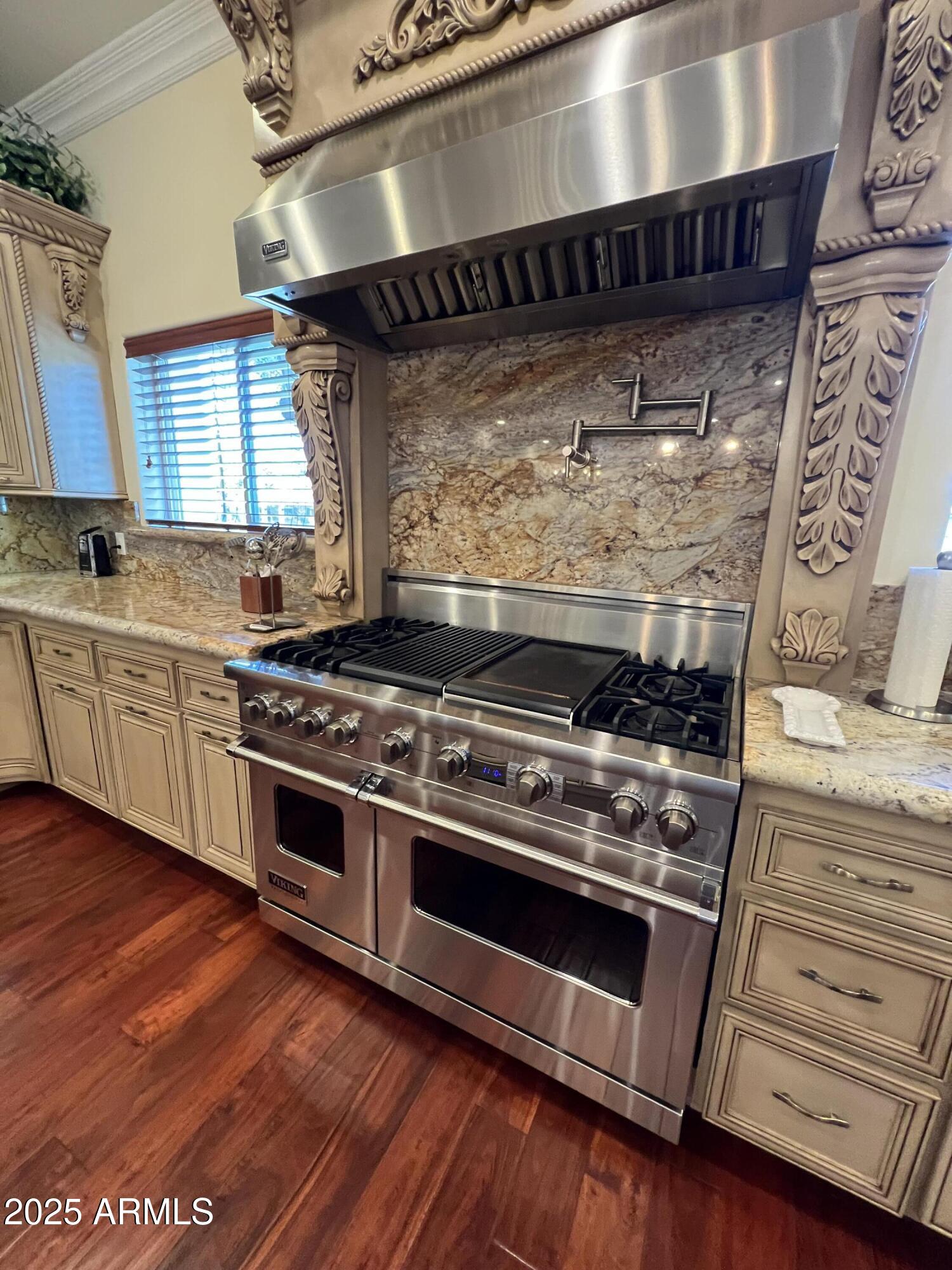 229 West Vista Avenue Phoenix, AZ 85021 - Photo 25 of 115 a kitchen with wooden floors and a stove