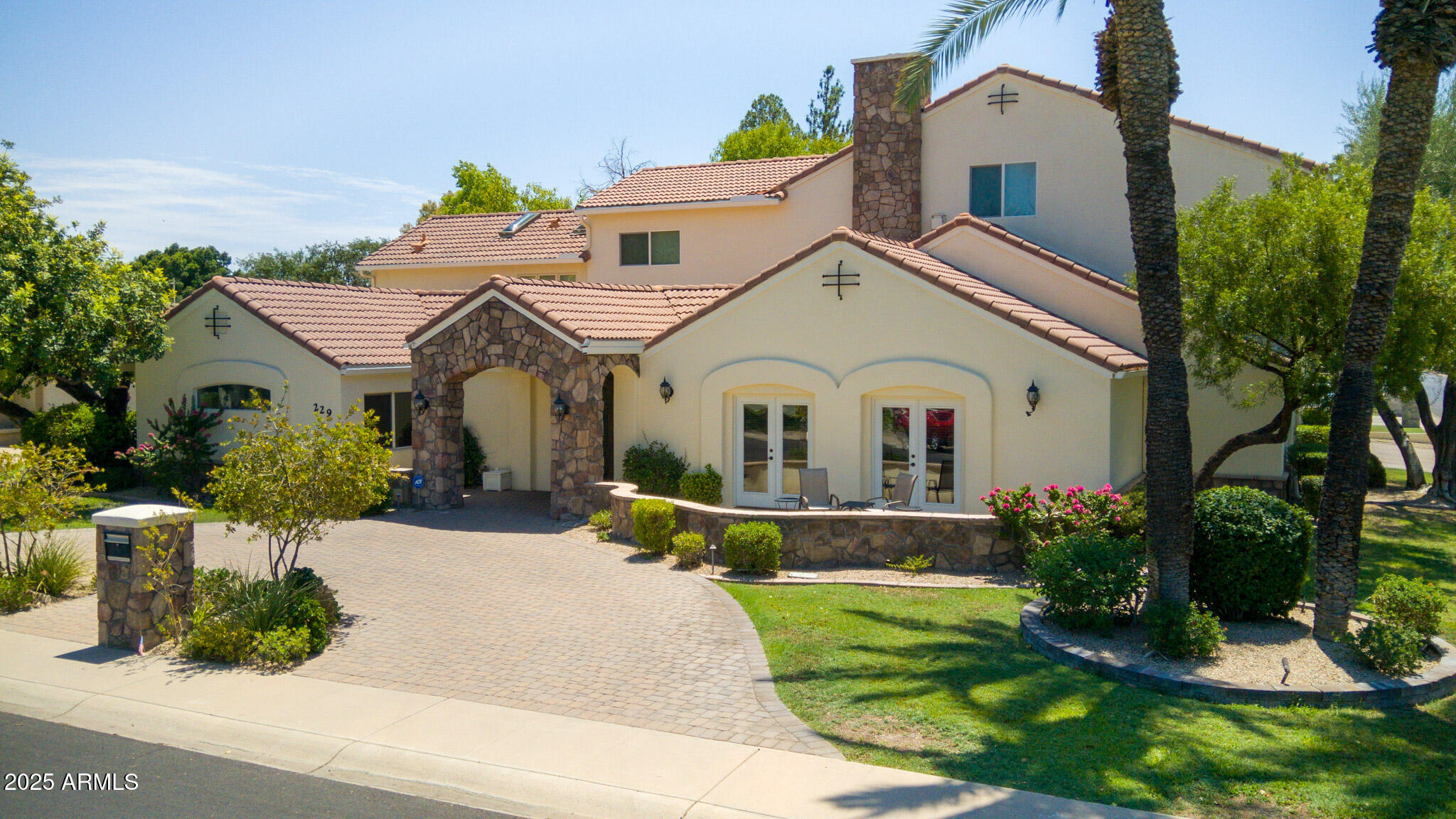 229 West Vista Avenue Phoenix, AZ 85021 - Photo 2 of 115 a front view of a house with a garden and plants