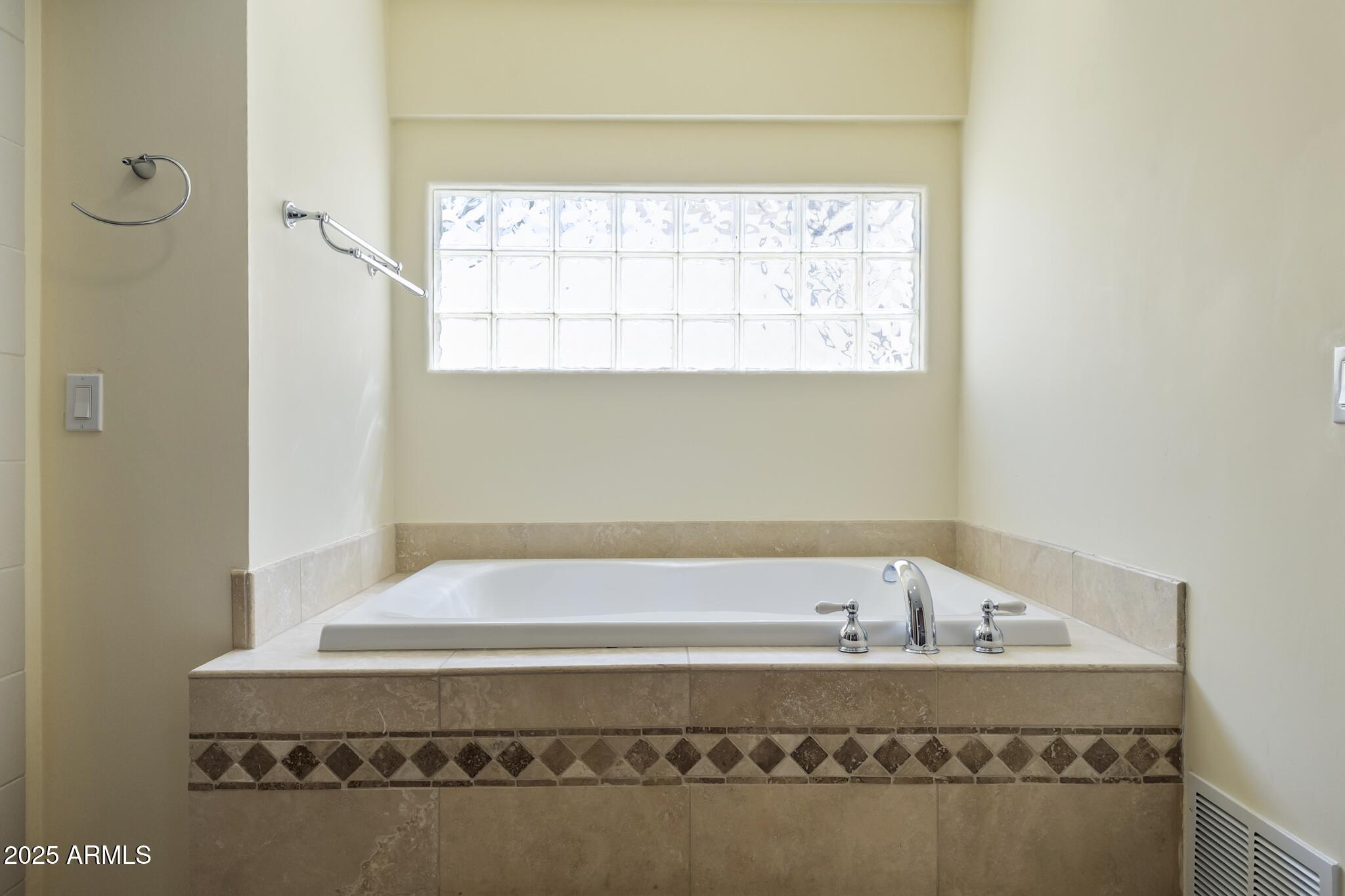 229 West Vista Avenue Phoenix, AZ 85021 - Photo 49 of 115 a bathroom with a bathtub and a window