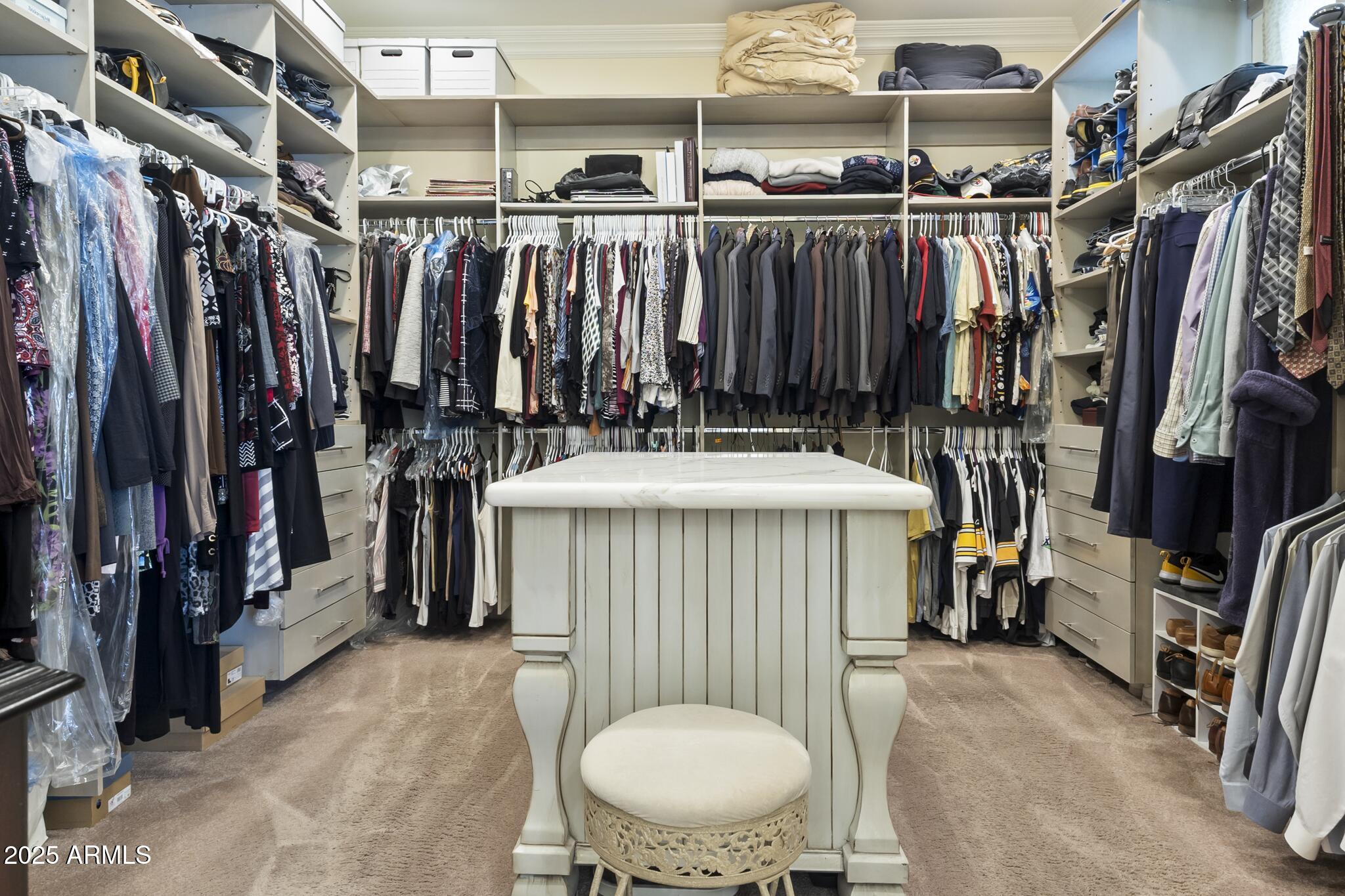 229 West Vista Avenue Phoenix, AZ 85021 - Photo 77 of 115 a view of walk in closet with clothes and shoes