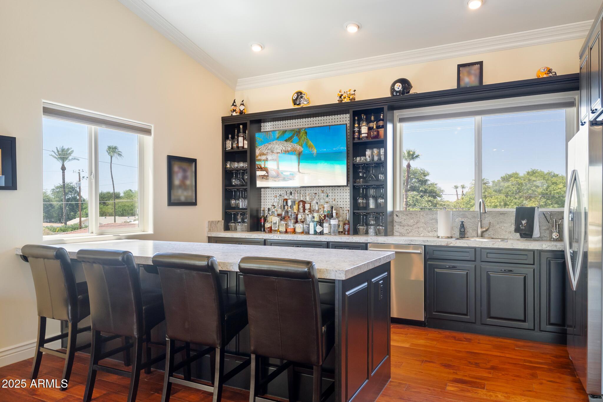229 West Vista Avenue Phoenix, AZ 85021 - Photo 80 of 115 a kitchen with stainless steel appliances granite countertop a stove a sink and a refrigerator