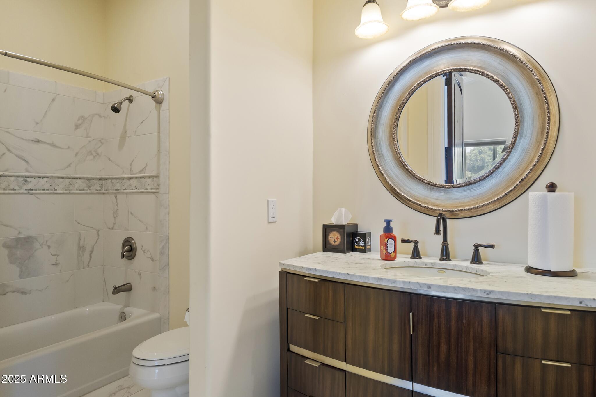 229 West Vista Avenue Phoenix, AZ 85021 - Photo 85 of 115 a bathroom with a sink a toilet and a mirror