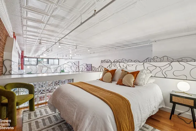 a bedroom with furniture and a bed