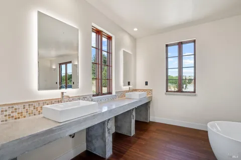 a bathroom with a sink toilet a shower and a mirror