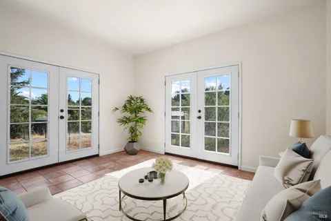 a spacious bedroom with a bed and a couch