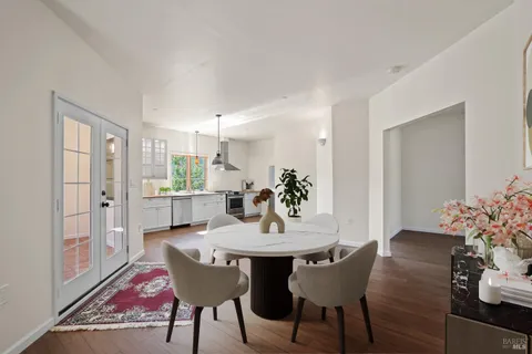 a view of a dining room with furniture and a table