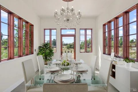 a kitchen with stainless steel appliances granite countertop a sink a stove and a wooden floors