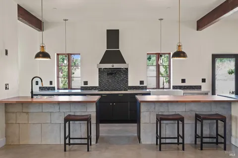 a spacious bedroom with a bed and a potted plant