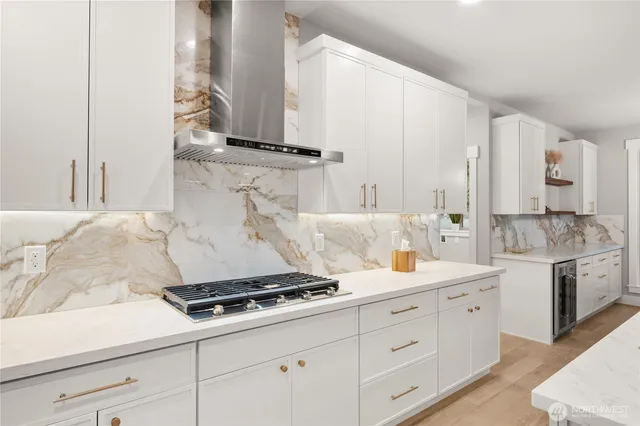 a kitchen with appliances cabinets and a counter top space