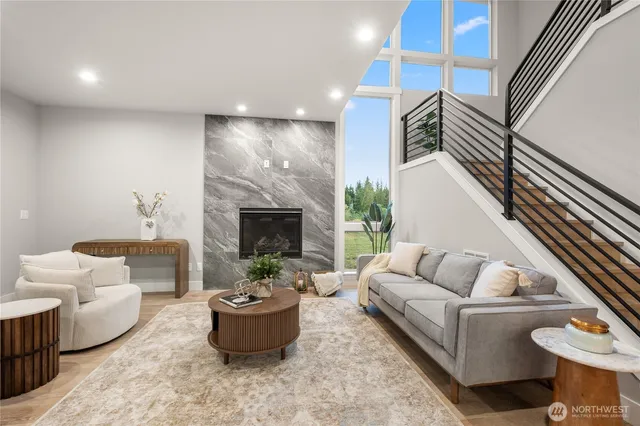 a living room with furniture and a fireplace