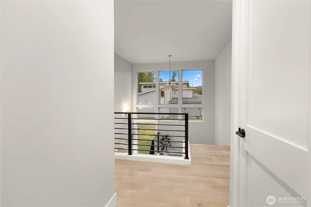 a spacious bedroom with a large bed and a window