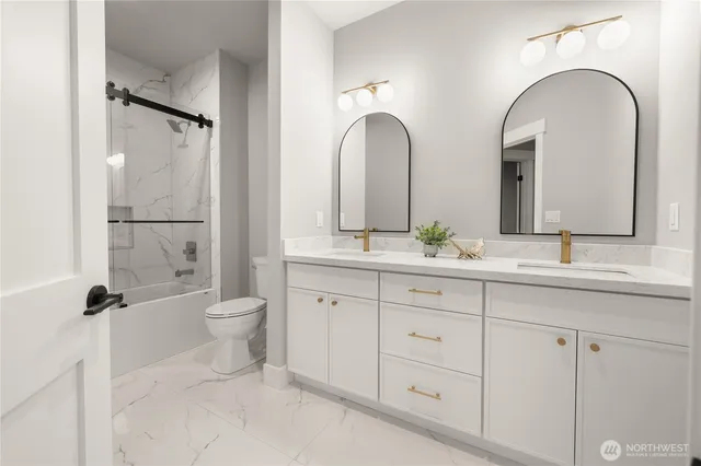 a spacious bedroom with a bed and a cabinets