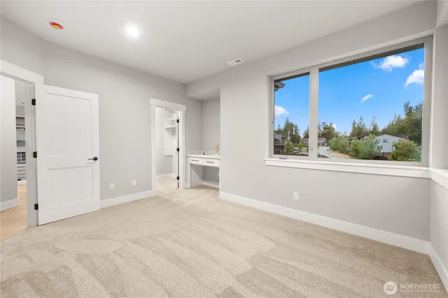 a bedroom with a bed and a night stand