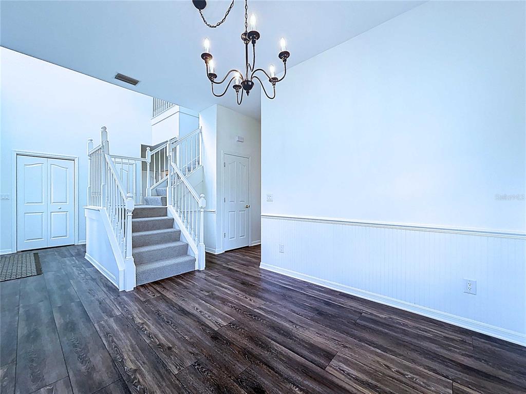 4103 North Rye Road Parrish, FL 34219 - Photo 11 of 40 a view of a room with wooden floor and staircase
