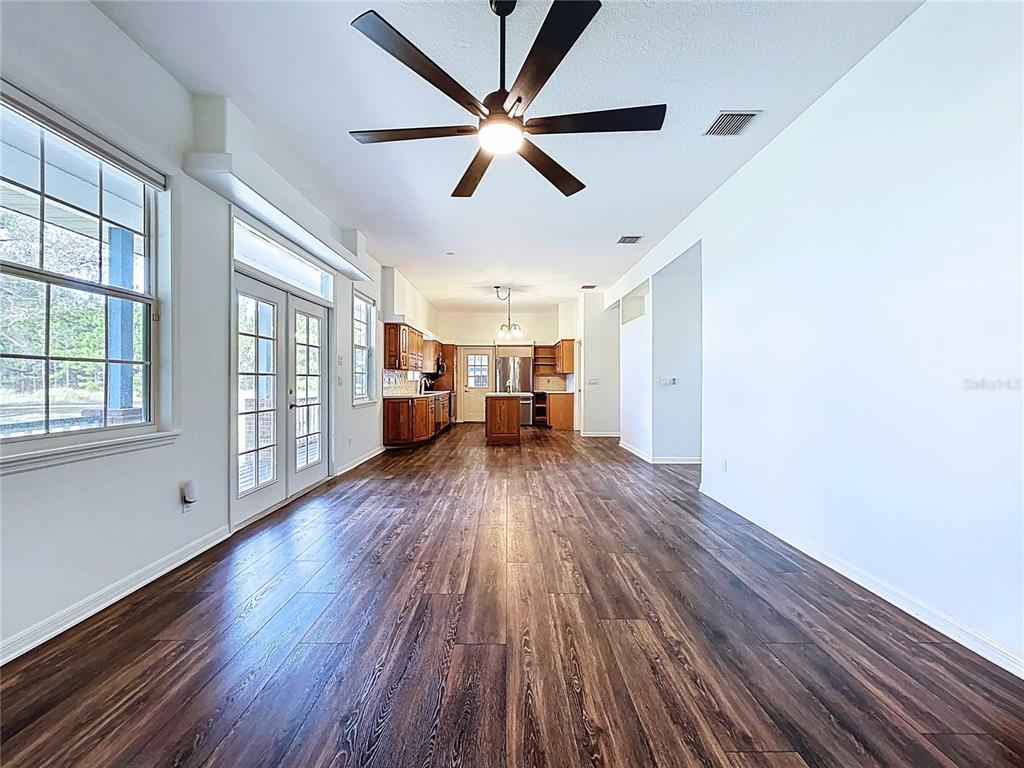 4103 North Rye Road Parrish, FL 34219 - Photo 13 of 40 a view of empty room with wooden floor and fan