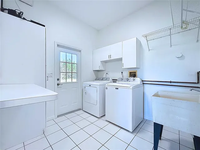 a kitchen with cabinets appliances and a counter top space