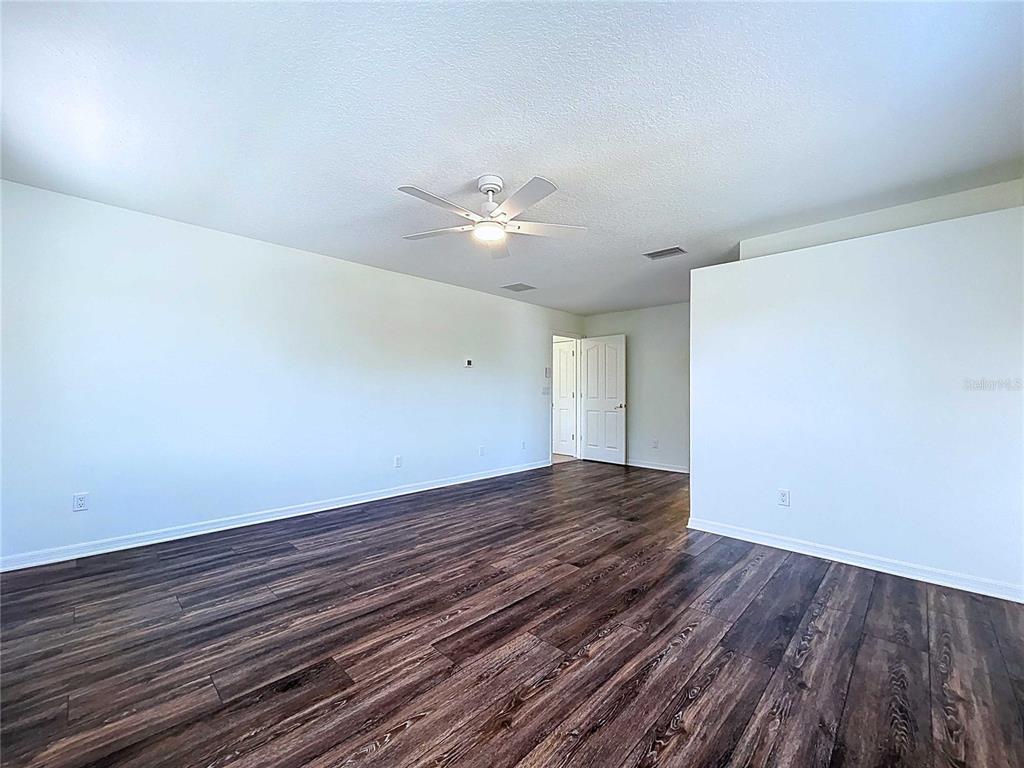 4103 North Rye Road Parrish, FL 34219 - Photo 25 of 40 wooden floor in an empty room