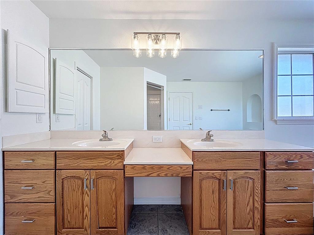4103 North Rye Road Parrish, FL 34219 - Photo 28 of 40 a utility room with stainless steel appliances cabinets and a sink
